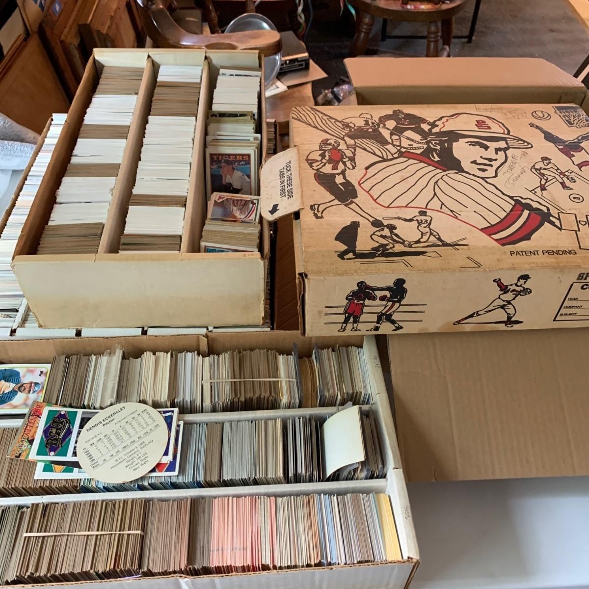 Vintage sports card collection in storage boxes
